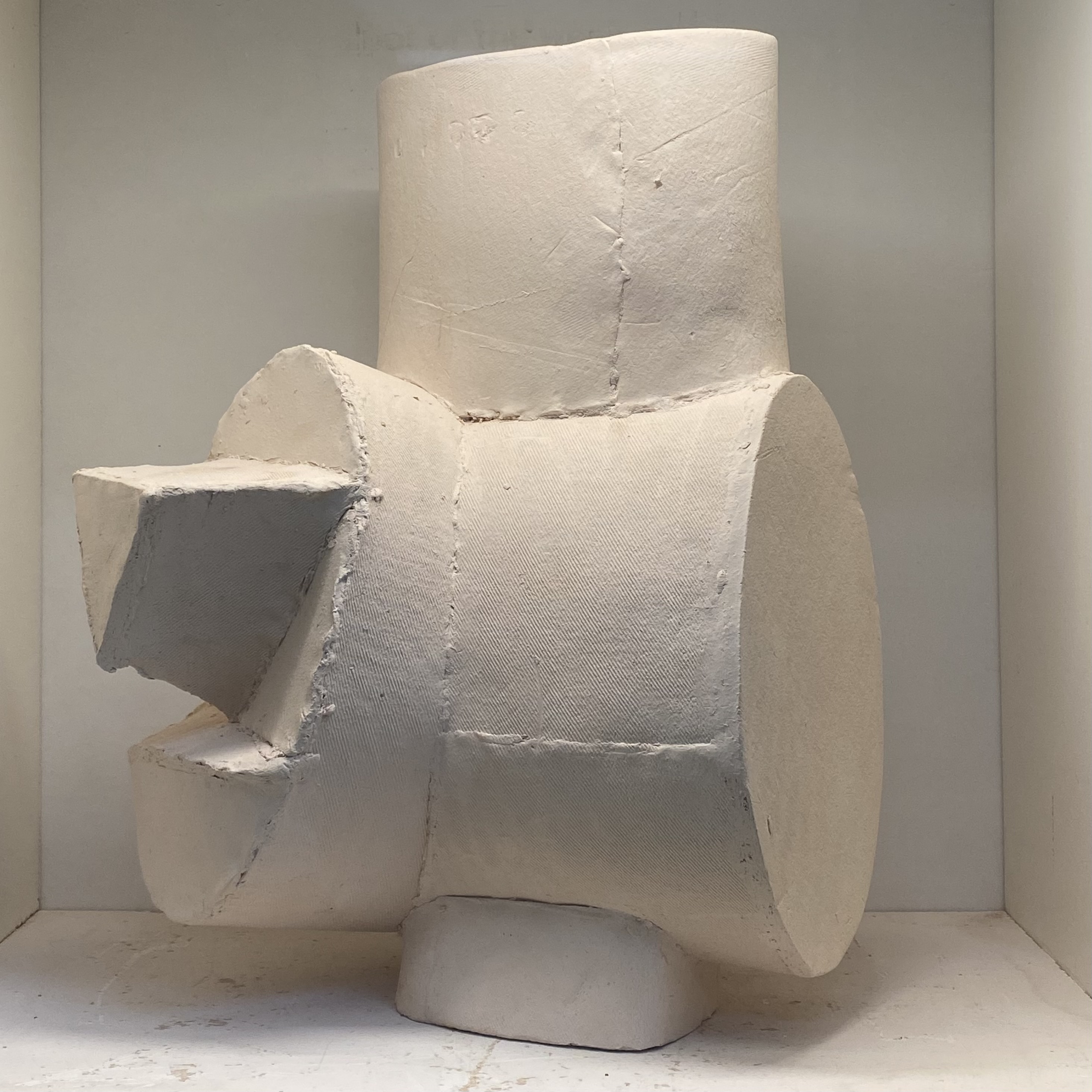 A sculpture piece incorporating multiple simples shapes made into a showcase object