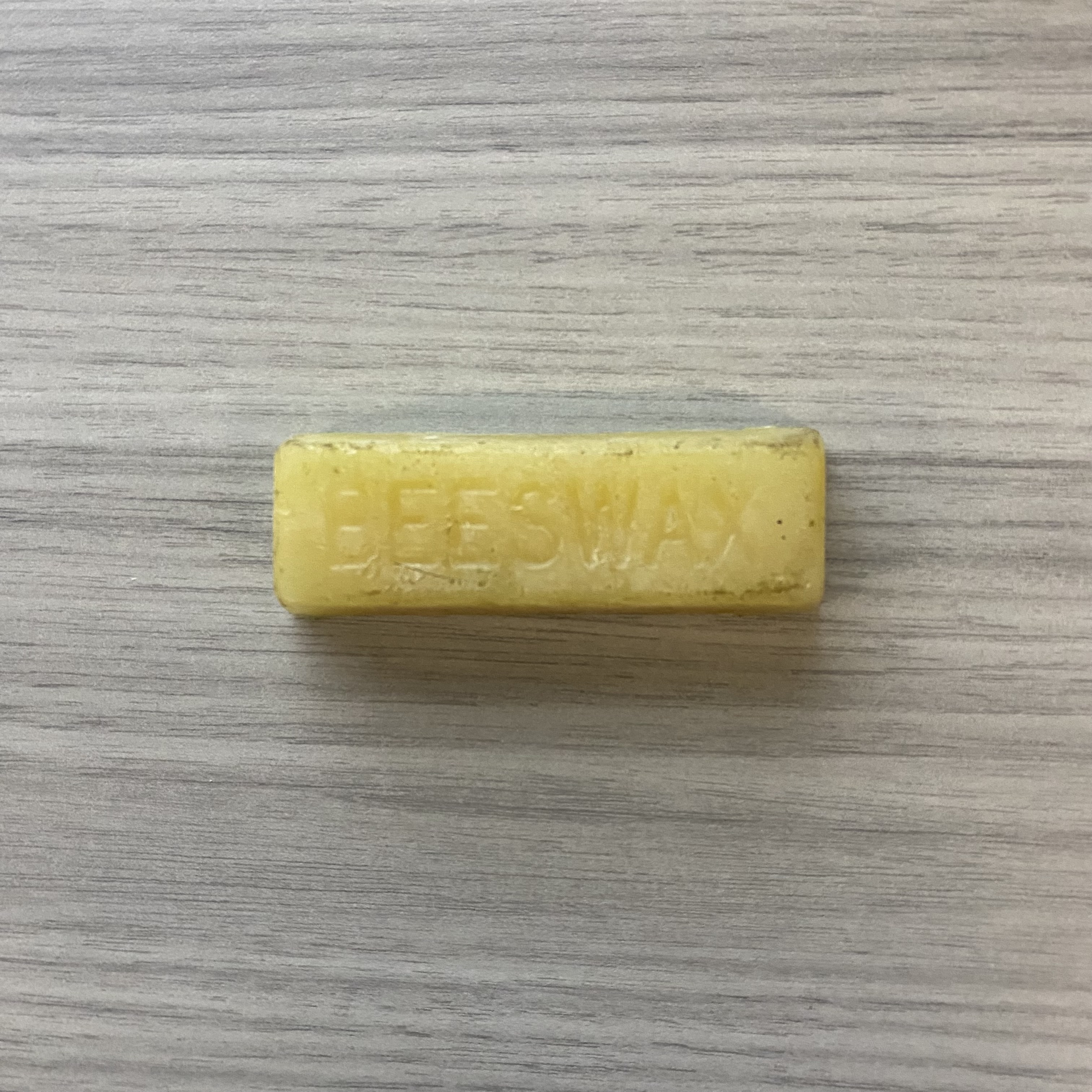 Material: Wax<br>
Color: Dark yellow <br>
Freeflow vs Solid: Solid<br>
Surface texture: Hard<br>
Material state: Rough<br>
Material use: Candles, lubricating material<br>